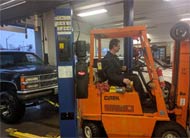 Garage forklift | Shop Management Alliance